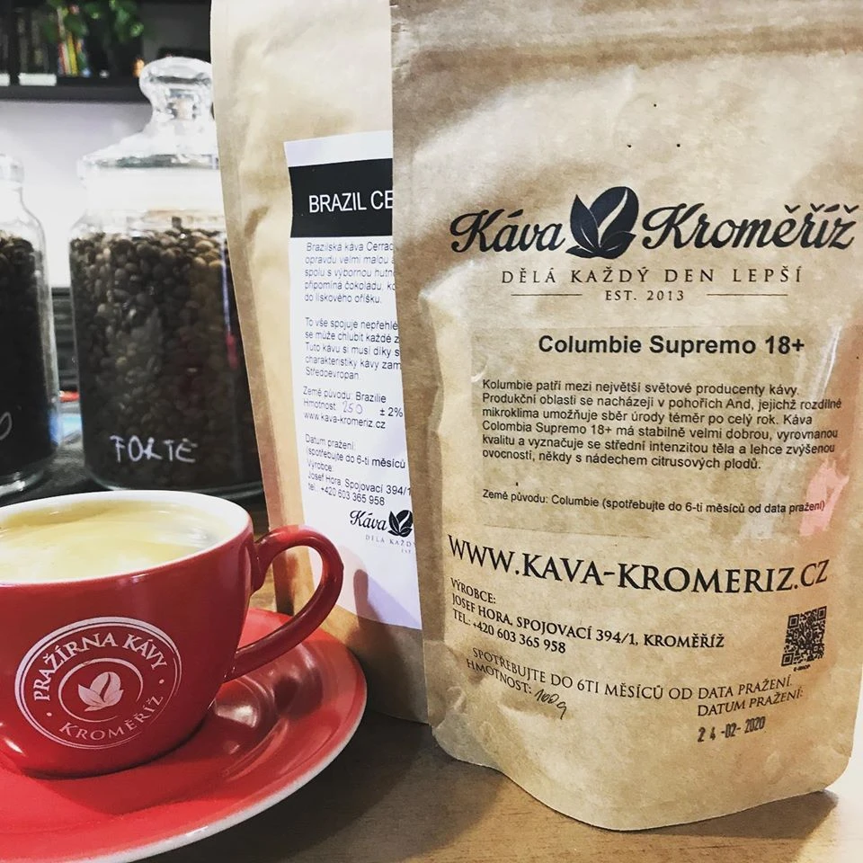 coffee with foam and a package of coffee from the family roastery Káva Kroměříž